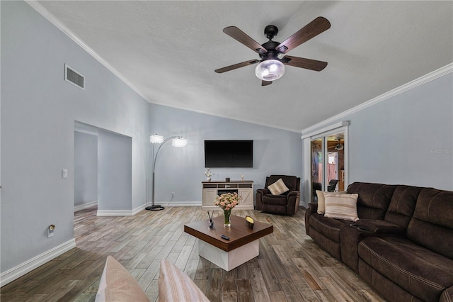 5346 Black Pine Dr, Tampa, FL 33624 - living room featuring ornamental molding, lofted ceiling, a ceiling fan, wood finished floors, and a textured ceiling