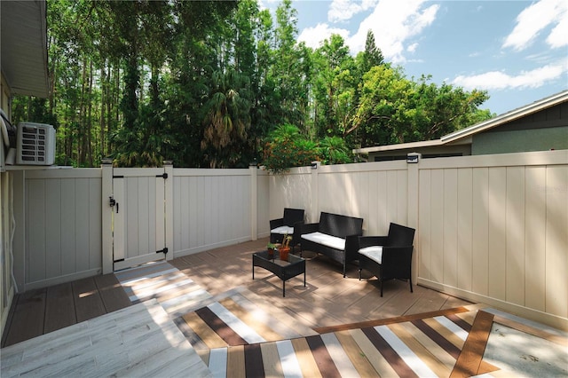 5346 Black Pine Dr, Tampa, FL 33624 - wooden terrace featuring a fenced backyard, a gate, and outdoor lounge area