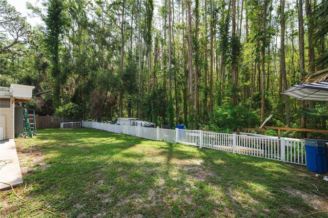 5346 Black Pine Dr, Tampa, FL 33624 - fenced yard featuring a forest view