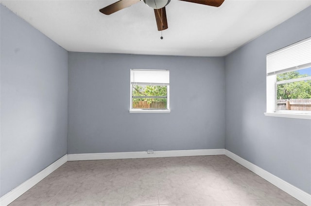 9310 N 12th St, Tampa, FL 33612 - spare room with healthy amount of natural light and ceiling fan