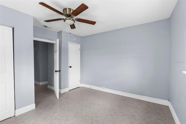 9310 N 12th St, Tampa, FL 33612 - unfurnished bedroom with baseboards and a ceiling fan