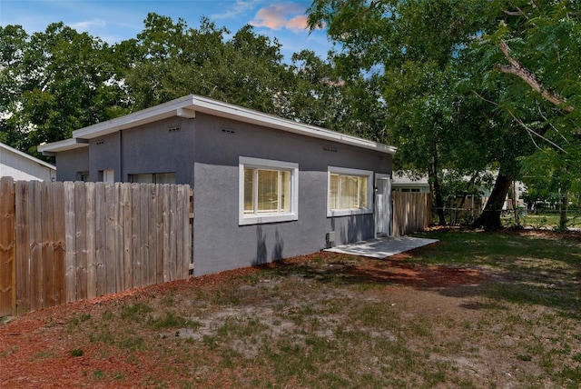 9310 N 12th St, Tampa, FL 33612 - view of side of property featuring stucco siding