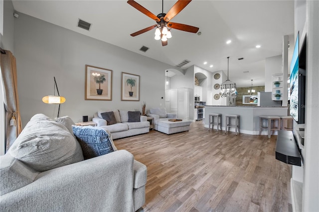 4512 Pointe O Woods Dr, Wesley Chapel, FL 33543 - living room with ceiling fan, light wood-type flooring, a chandelier, and recessed lighting