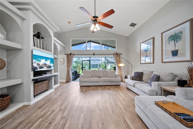4512 Pointe O Woods Dr, Wesley Chapel, FL 33543 - living room with wood finished floors, high vaulted ceiling, ceiling fan, and built in features