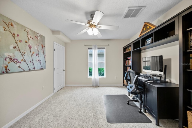 4512 Pointe O Woods Dr, Wesley Chapel, FL 33543 - home office featuring a ceiling fan, light colored carpet, and a textured ceiling