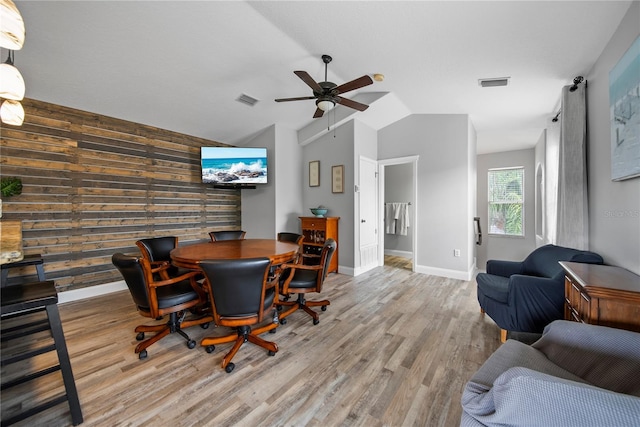 4512 Pointe O Woods Dr, Wesley Chapel, FL 33543 - dining area with ceiling fan, wood finished floors, vaulted ceiling, and wooden walls