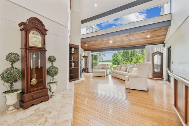 2103 N Golfview Dr, Plant City, FL 33566 - living room featuring a towering ceiling, light wood-style flooring, and recessed lighting