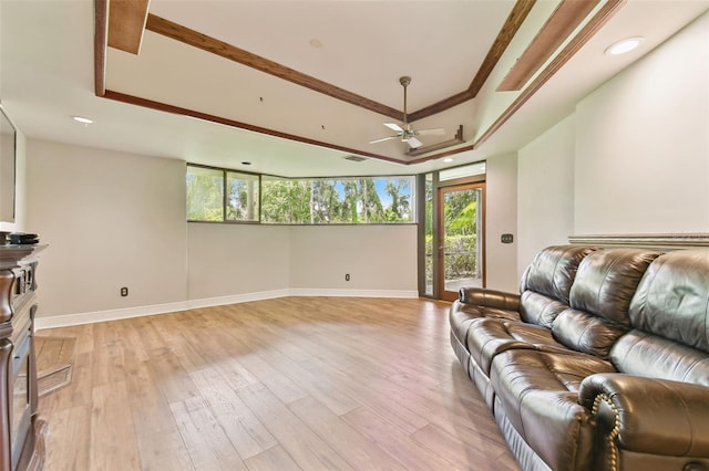 2103 N Golfview Dr, Plant City, FL 33566 - living area featuring ceiling fan, light wood-style flooring, and a raised ceiling