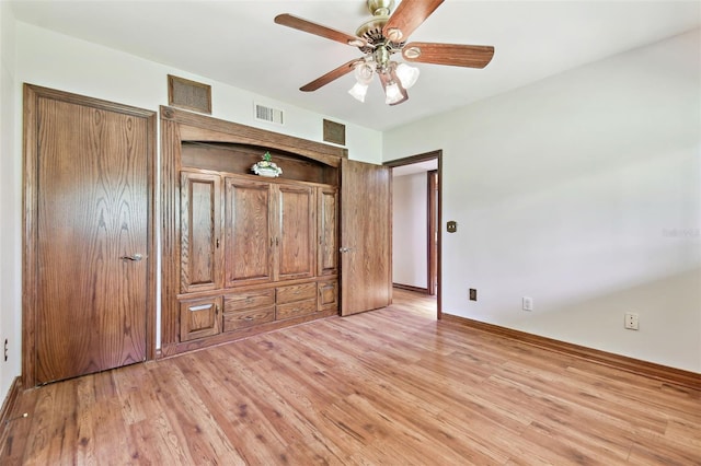 2103 N Golfview Dr, Plant City, FL 33566 - unfurnished bedroom with light wood finished floors and ceiling fan