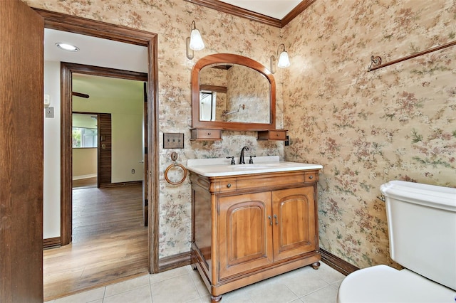 2103 N Golfview Dr, Plant City, FL 33566 - bathroom featuring vanity, tile patterned floors, wallpapered walls, and ornamental molding
