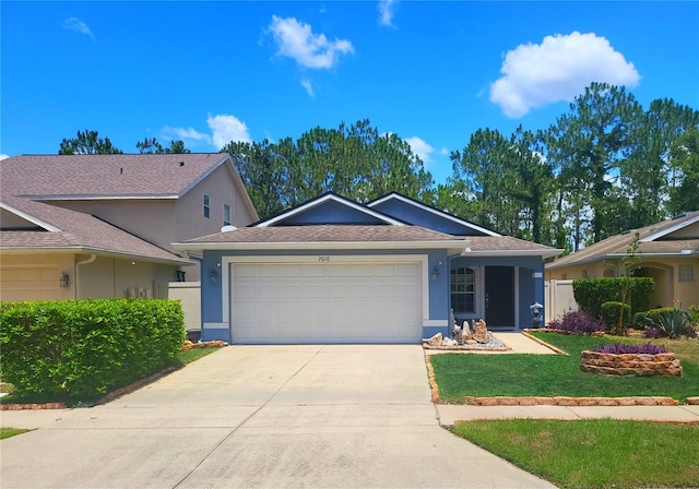 7010 Kendall Heath Way, Land O Lakes, FL 34637 - ranch-style house with stucco siding, an attached garage, driveway, and a front yard