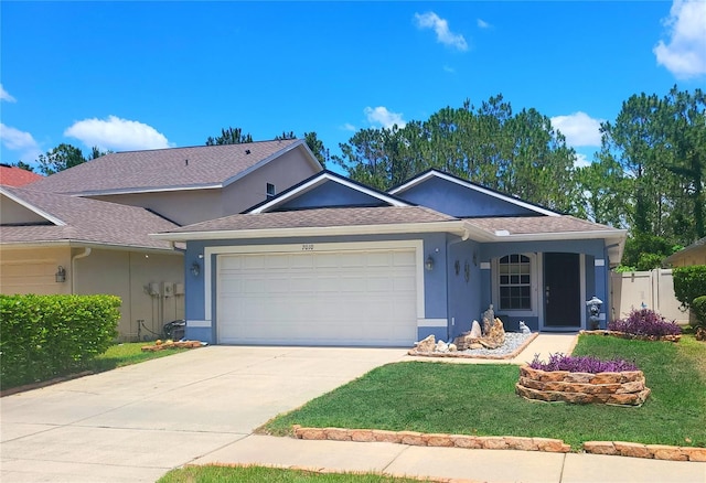 7010 Kendall Heath Way, Land O Lakes, FL 34637 - ranch-style house featuring a garage, stucco siding, driveway, and a shingled roof