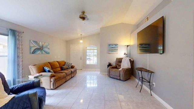 7010 Kendall Heath Way, Land O Lakes, FL 34637 - living area with vaulted ceiling and light tile patterned flooring