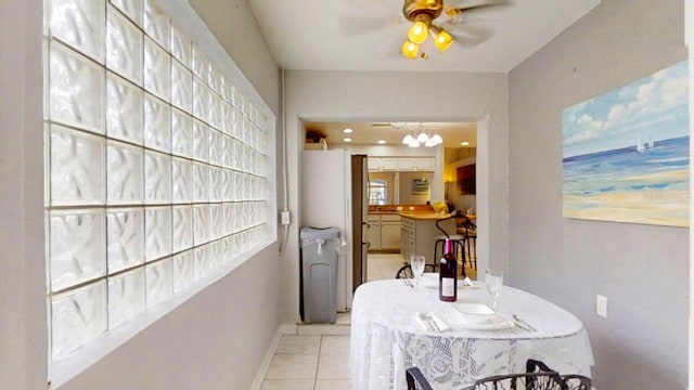 7010 Kendall Heath Way, Land O Lakes, FL 34637 - dining room featuring a ceiling fan and a chandelier