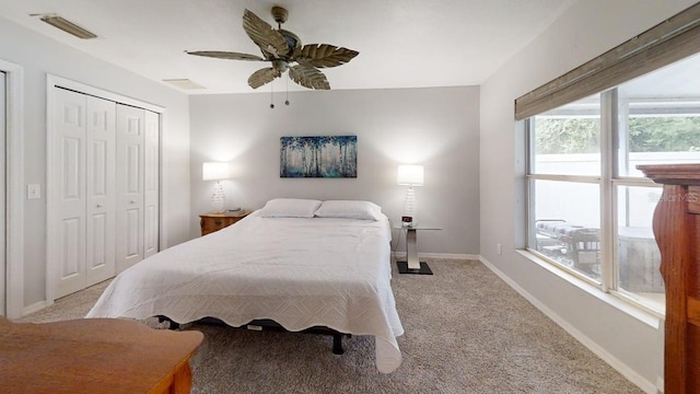 7010 Kendall Heath Way, Land O Lakes, FL 34637 - carpeted bedroom featuring a closet and a ceiling fan
