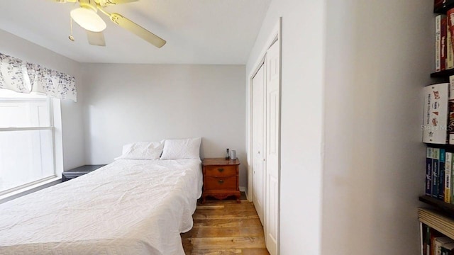 7010 Kendall Heath Way, Land O Lakes, FL 34637 - bedroom with wood finished floors, a closet, and a ceiling fan