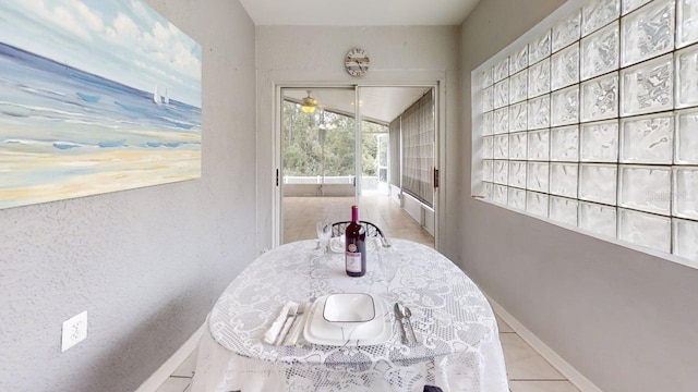 7010 Kendall Heath Way, Land O Lakes, FL 34637 - corridor featuring baseboards and tile patterned flooring