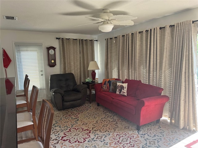 10185 Santiago Ct, Seminole, FL 33776 - living area featuring a ceiling fan