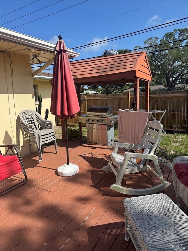 10185 Santiago Ct, Seminole, FL 33776 - wooden terrace with area for grilling