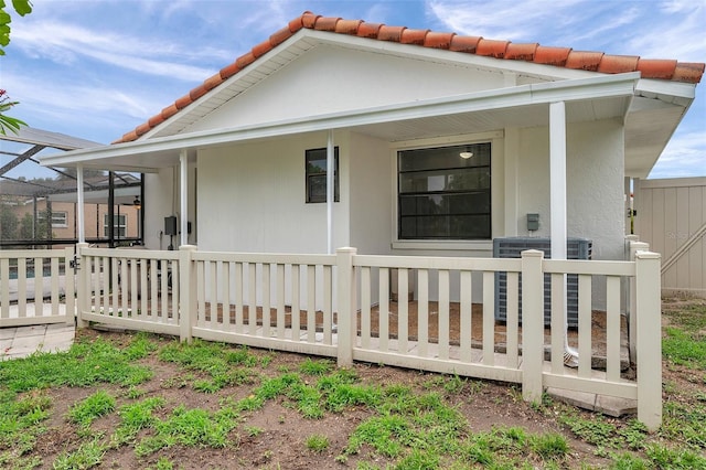 734 Flamingo Dr, Apollo Beach, FL 33572 - view of side of property with a central AC unit and a tile roof