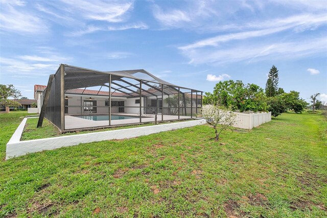 734 Flamingo Dr, Apollo Beach, FL 33572 - view of green lawn featuring an outdoor pool, a lanai, and a patio