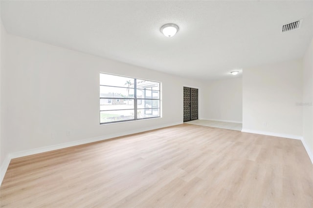 734 Flamingo Dr, Apollo Beach, FL 33572 - spare room with light wood-style floors and baseboards