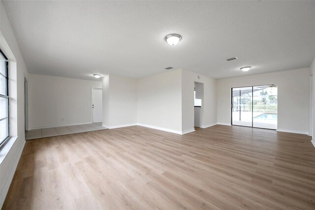 734 Flamingo Dr, Apollo Beach, FL 33572 - empty room featuring light wood-style floors