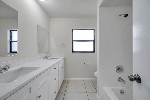 734 Flamingo Dr, Apollo Beach, FL 33572 - full bath featuring healthy amount of natural light, double vanity, tile patterned floors, and shower / washtub combination