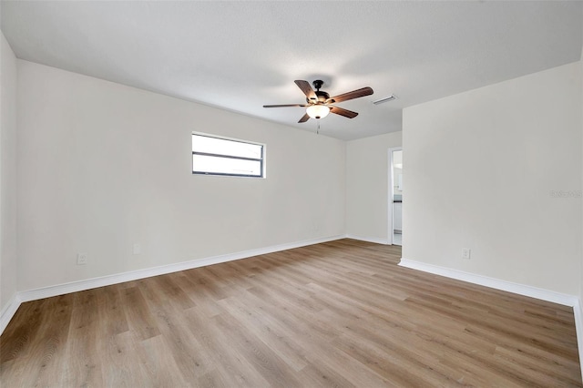 734 Flamingo Dr, Apollo Beach, FL 33572 - spare room featuring ceiling fan and light wood-type flooring
