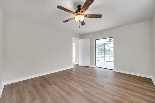 734 Flamingo Dr, Apollo Beach, FL 33572 - unfurnished room featuring a ceiling fan and light wood-style flooring
