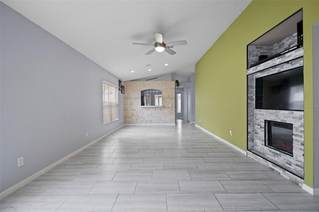 8526 Quarter Horse Dr, Riverview, FL 33578 - unfurnished living room featuring lofted ceiling, a ceiling fan, and a fireplace