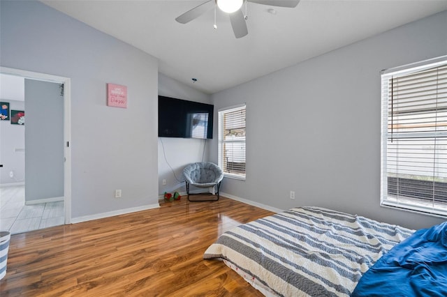 8526 Quarter Horse Dr, Riverview, FL 33578 - bedroom featuring lofted ceiling, wood finished floors, and ceiling fan