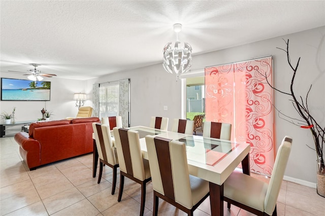 17509 Queensland St, Land O Lakes, FL 34638 - dining room with a chandelier, light tile patterned floors, a textured ceiling, and ceiling fan