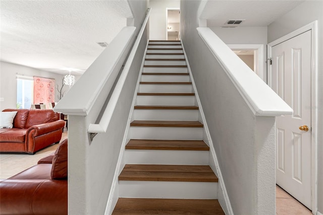 17509 Queensland St, Land O Lakes, FL 34638 - stairs with a textured ceiling
