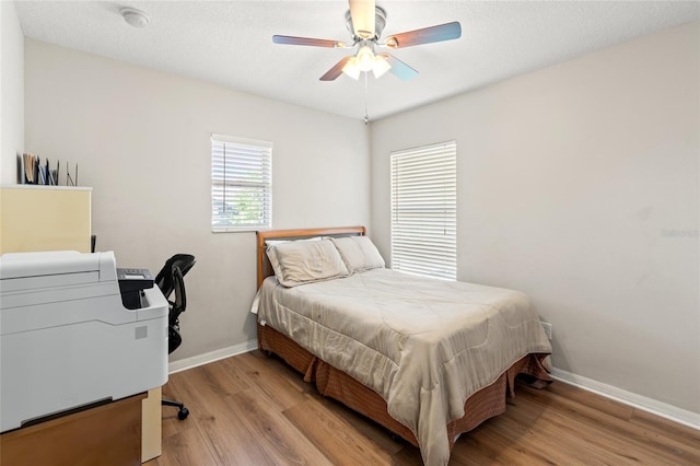 17509 Queensland St, Land O Lakes, FL 34638 - bedroom with wood finished floors and ceiling fan