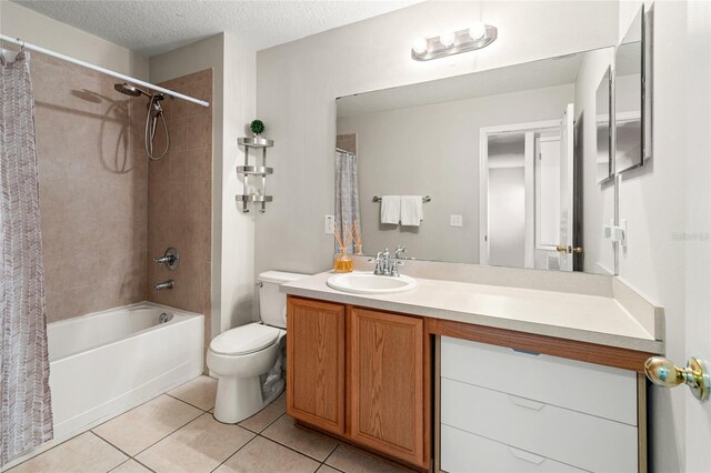 17509 Queensland St, Land O Lakes, FL 34638 - full bathroom featuring tile patterned floors, vanity, shower / tub combo, and a textured ceiling