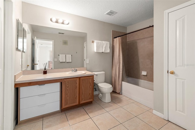 17509 Queensland St, Land O Lakes, FL 34638 - full bath featuring vanity, tile patterned flooring, shower / bathtub combination with curtain, and a textured ceiling