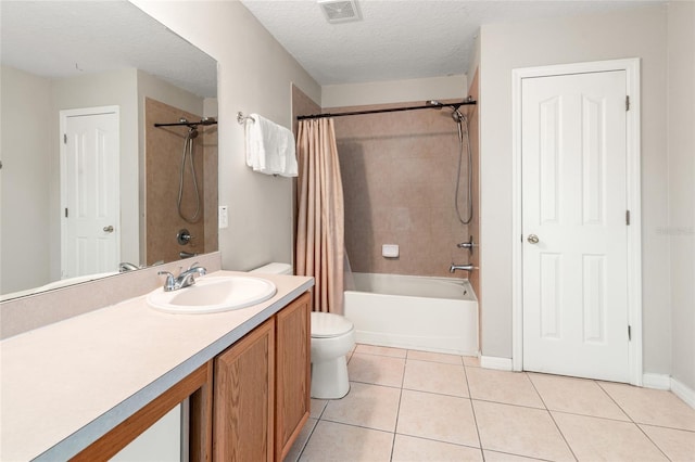 17509 Queensland St, Land O Lakes, FL 34638 - bathroom with vanity, shower / tub combo with curtain, tile patterned floors, and a textured ceiling