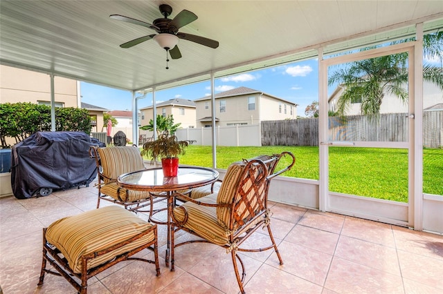 17509 Queensland St, Land O Lakes, FL 34638 - sunroom with outdoor dining space, a ceiling fan, and a residential view