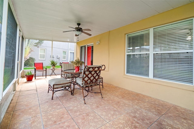 17509 Queensland St, Land O Lakes, FL 34638 - sunroom featuring a ceiling fan and tile patterned flooring