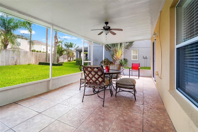 17509 Queensland St, Land O Lakes, FL 34638 - sunroom / solarium with a ceiling fan and outdoor dining area
