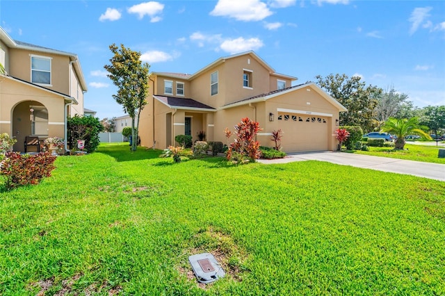17509 Queensland St, Land O Lakes, FL 34638 - traditional-style home featuring stucco siding, concrete driveway, a front yard, and an attached garage