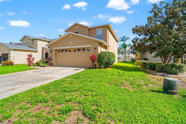 17509 Queensland St, Land O Lakes, FL 34638 - traditional-style house with stucco siding, driveway, a front lawn, and an attached garage