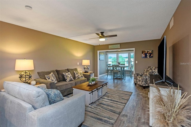 940 Virginia St Unit 303, Dunedin, FL 34698 - living room featuring ceiling fan and dark wood-type flooring