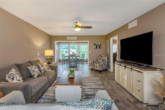 940 Virginia St Unit 303, Dunedin, FL 34698 - living area featuring dark wood finished floors and a ceiling fan
