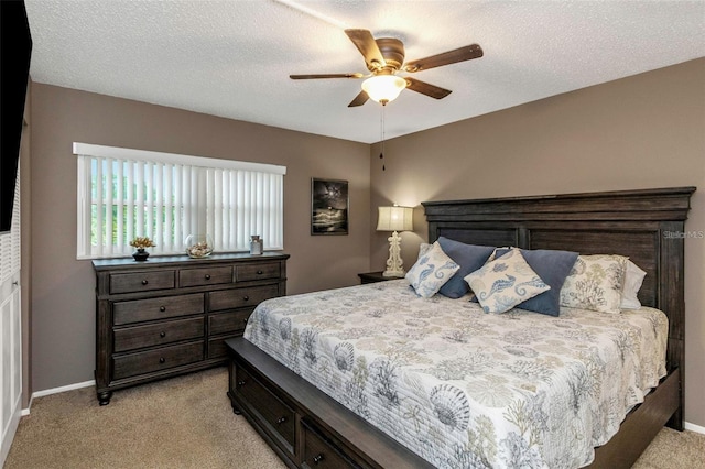 940 Virginia St Unit 303, Dunedin, FL 34698 - bedroom featuring light carpet, a ceiling fan, and a textured ceiling