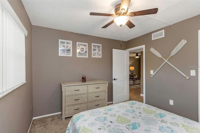940 Virginia St Unit 303, Dunedin, FL 34698 - carpeted bedroom with a textured ceiling and ceiling fan