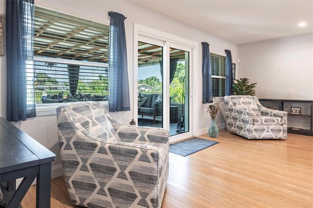 3312 Kenmore Dr, Sarasota, FL 34231 - living room featuring wood finished floors and recessed lighting