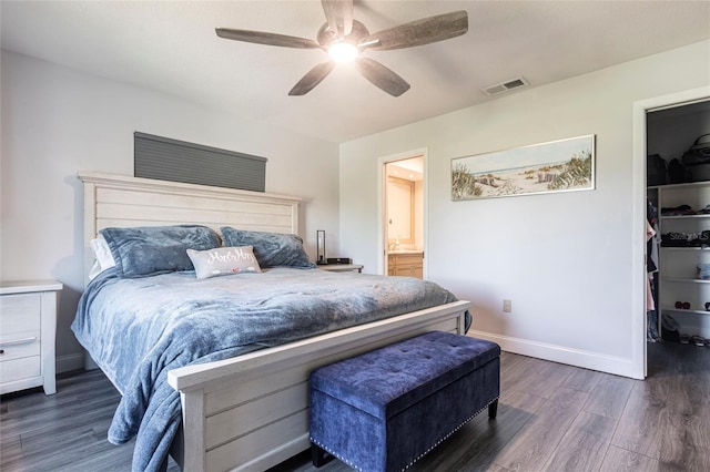 3312 Kenmore Dr, Sarasota, FL 34231 - bedroom featuring dark wood-type flooring, a walk in closet, a ceiling fan, ensuite bath, and a closet