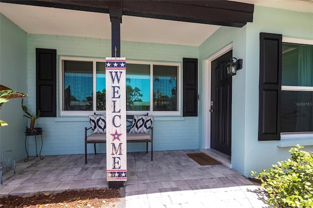 3312 Kenmore Dr, Sarasota, FL 34231 - view of exterior entry featuring a porch